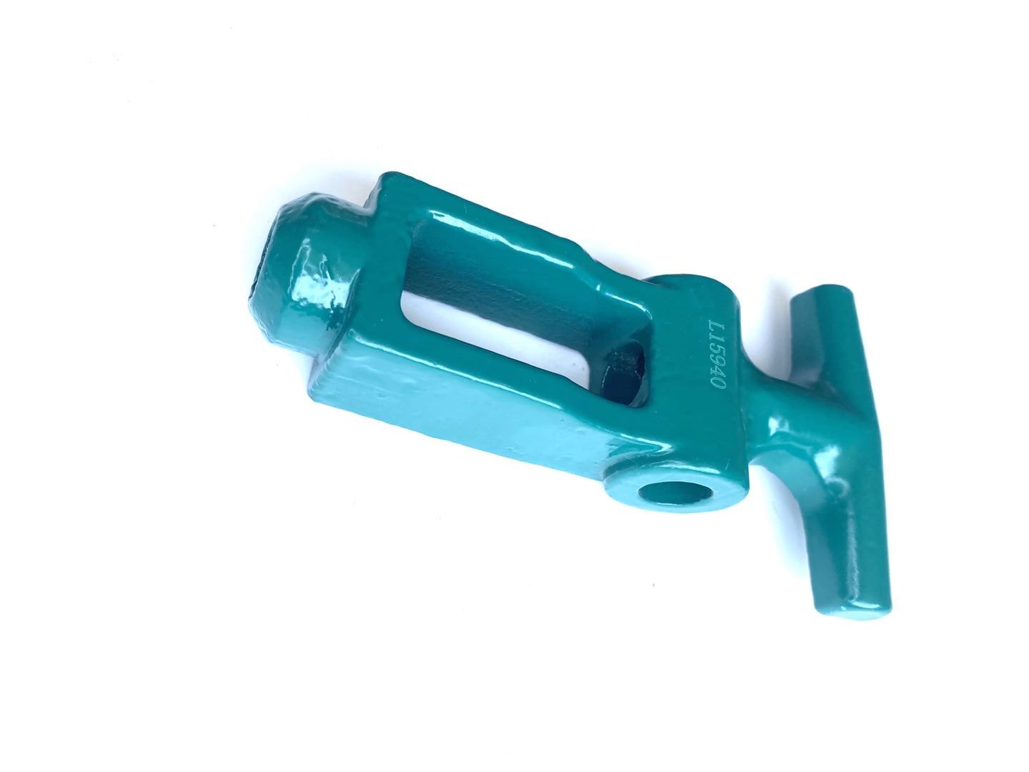 Cast lever part with turquoise coating for agricultural equipment