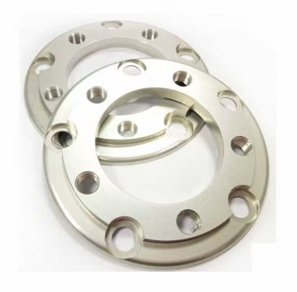 Pair of machined flange rings with bolt holes