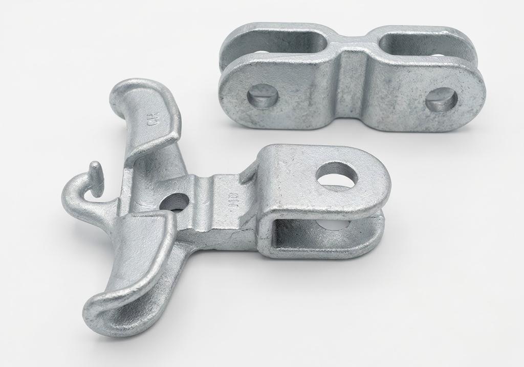 Galvanized power line hardware samples on white background